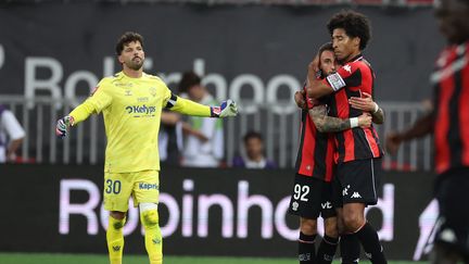 Nice players Dante and Jonathan Clauss celebrate after a goal in the Ligue 1/Ligue 2 playoff match against Saint-Étienne