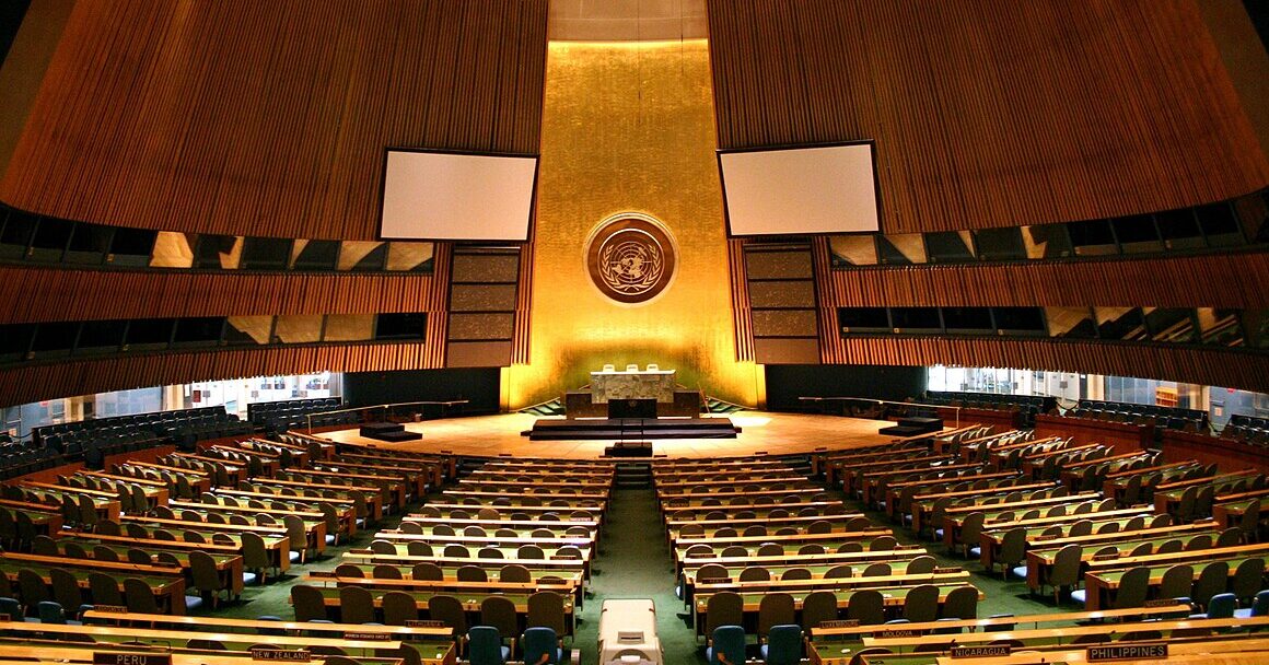 United Nations General Assembly hall with wooden desks arranged in semicircles