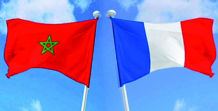 French and Moroccan flags waving together