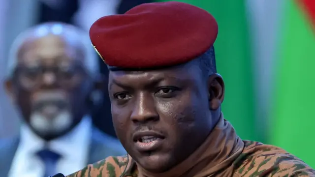 Close-up of Ibrahim Traoré in military attire with a red beret