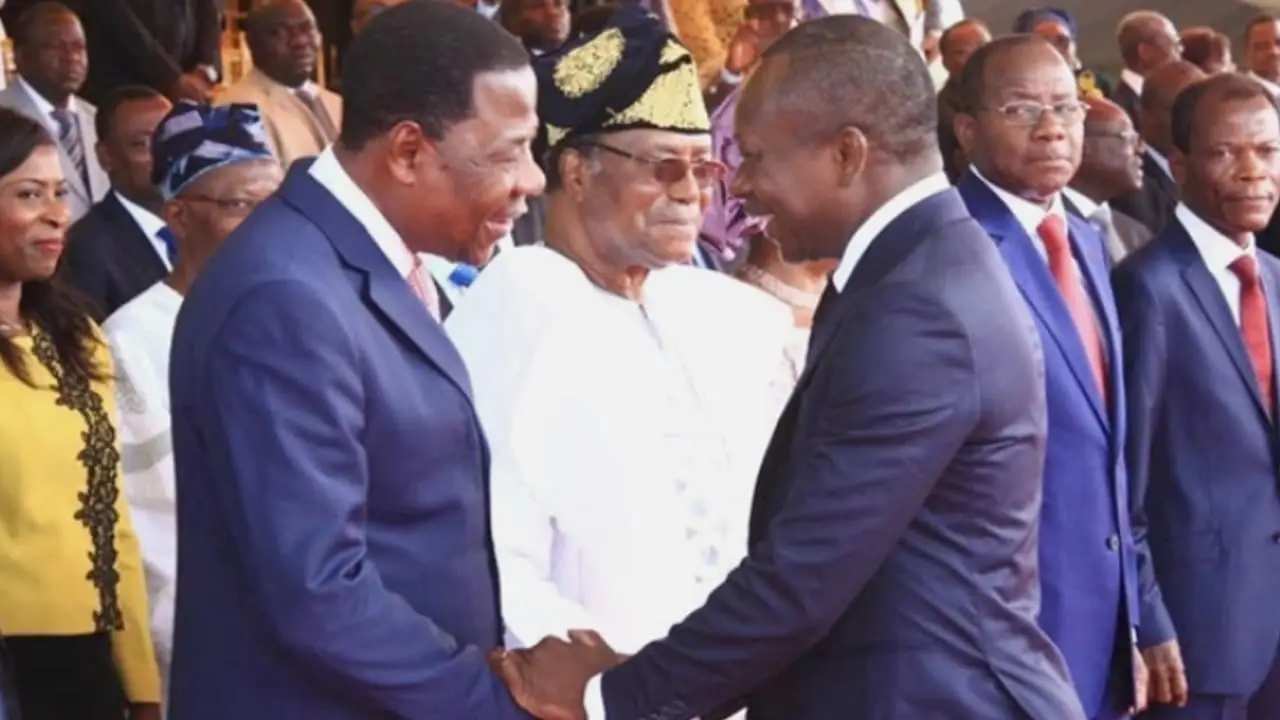 Former presidents Nicéphore Soglo (background in white), Boni Yayi (left) and incumbent Patrice Talon (right)