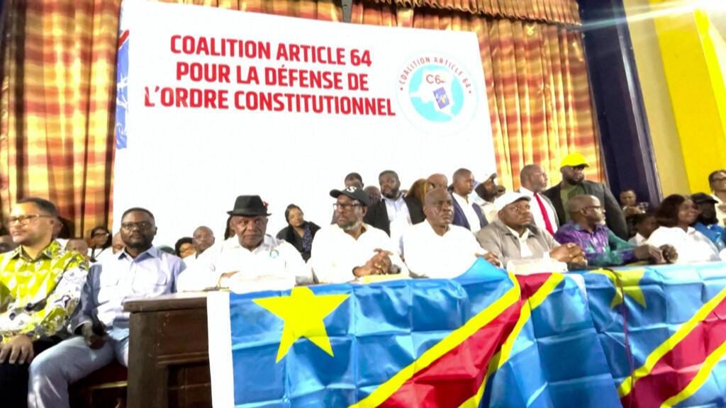 Opposition leaders from the C64 coalition seated at a podium in Kinshasa, DRC